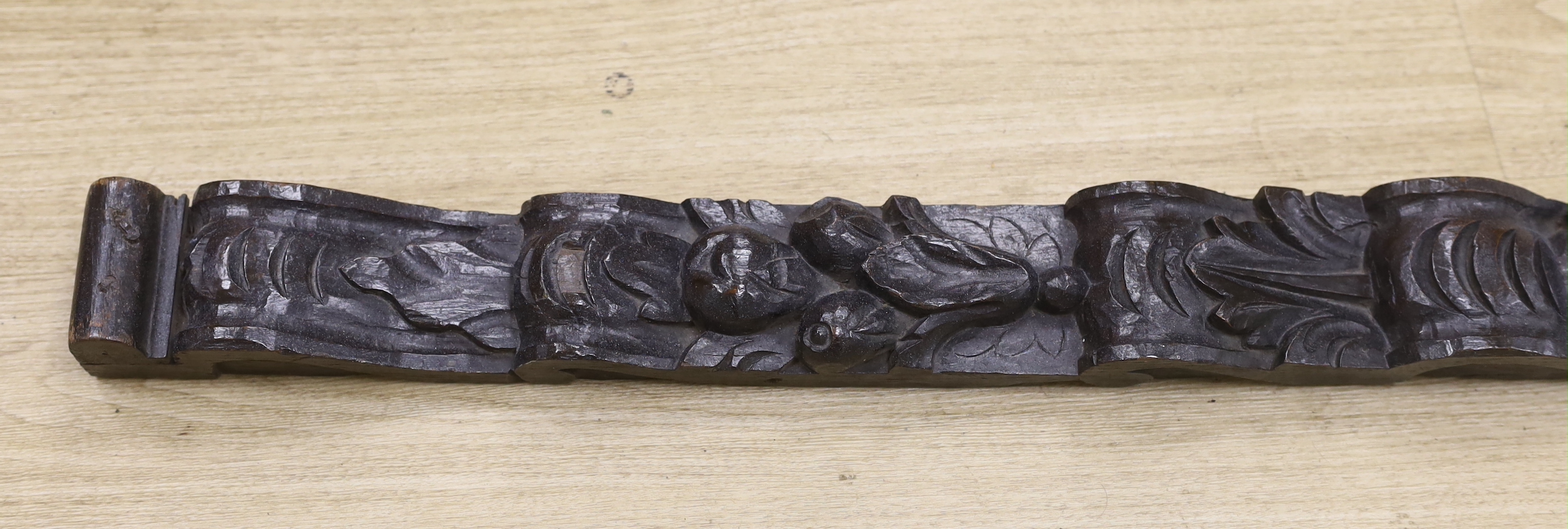 An 18th century carved oak figural pilaster, 83cm long